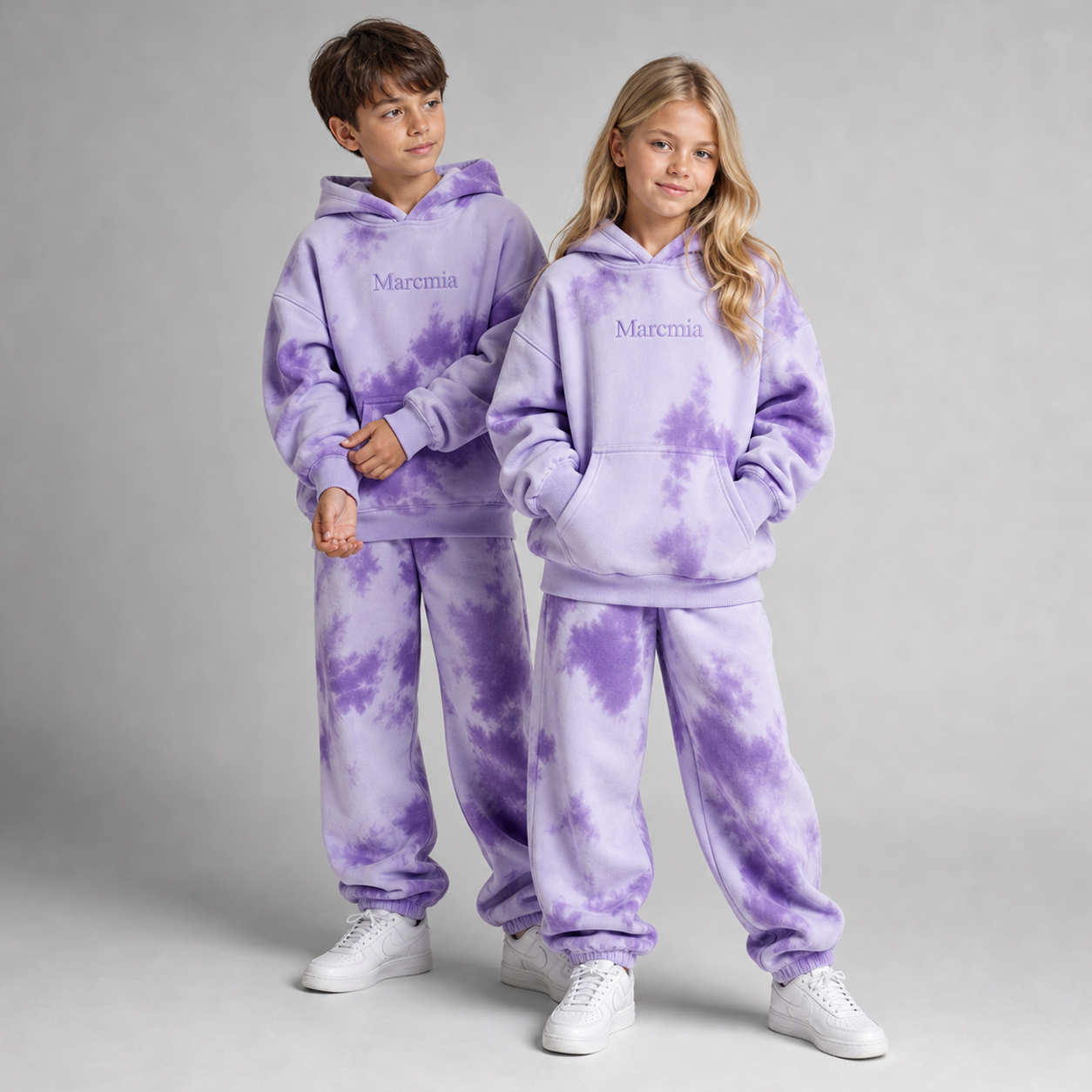 Children wearing purple tie dye Marcmia hoodie sets
